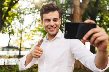 Fototapeta premium Happy young businessman wearing shirt