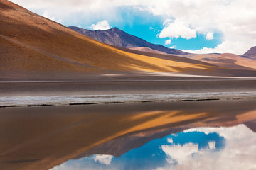 Lagoon reflecting mountains in Bolivia 