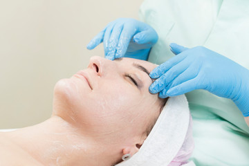 Process cosmetic mask of massage and facials in beauty salon 