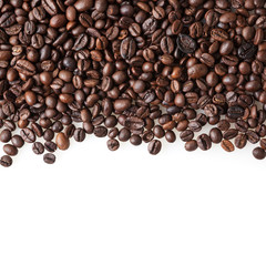 Roasted coffee beans on white background with copy space