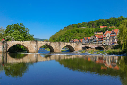 Lovely panoramic view of the Old Werra Bridge (Alte Werrabrücke), a stone arch bridge built in the medieval times in Hann. Münden a town in Lower Saxony, Germany, on a nice day with a blue sky.