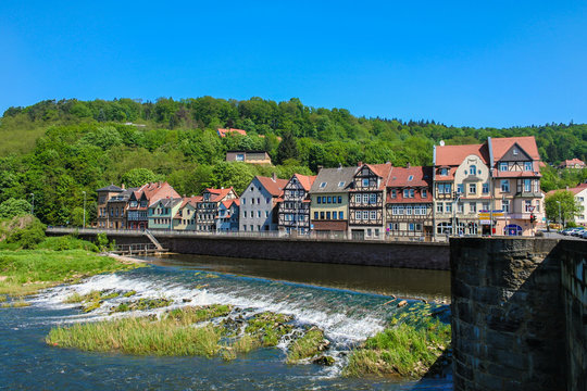Panoramic view of the river Werra, the barrage and the riverside with its beautiful traditional half-timbered houses of Hann. Münden, a town in Lower Saxony, Germany on a nice sunny day with blue sky.