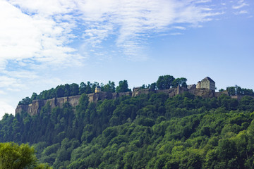 Fototapeta premium Dinstanced view on Königstein castle from river Elbe in Saxony, Germany