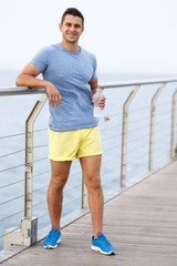 Man drinking water during workout