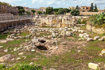 HAGAR QIM, MALTA - NOV 11, 2012: Hagar Qim, ancient Megalithic Temple of Malta, is a unesco world heritage site on the island nation of Malta.