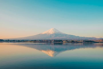 Reflection of Fuji mountain with snow capped in the morning Sunrise at Lake kawaguchiko, Yamanashi, Japan. landmark and popular for tourist attractions