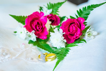 Gift wedding background with Diamond&Golden rings.