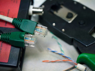 UTP ethernet cables.close up macro shot  with tools and cables background.