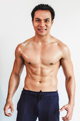 Fototapeta premium Asian young man with muscular body On the white back