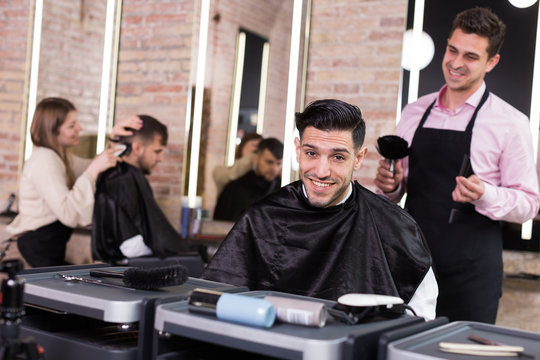 Satisfied male client of barbershop