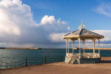 The Dun Laoghaire bandstand landmark located on the East pier of the harbour in Dublin, Ireland. Victorian cast iron filigree bandstand. - obrazy, fototapety, plakaty