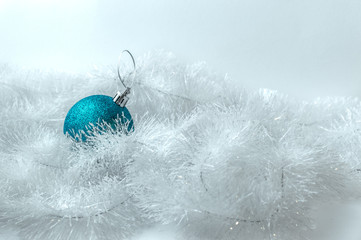blue christmas ball on snow