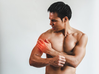 Asian man with muscular arm injury. From exercise on White background.