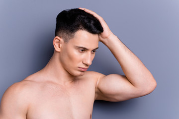 Fototapeta premium Close up portrait of half turn man stand isolated on gray backgr