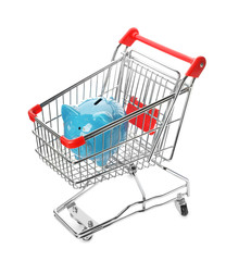 Piggy bank in shopping cart isolated on white