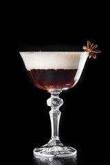 Hot Coffee layered Cocktail isolated on black in a beautiful glass. close up. series of photos. dark background