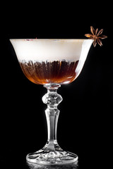 Hot Coffee layered Cocktail isolated on black in a beautiful glass. close up. series of photos. dark background