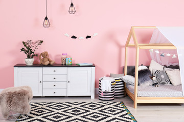 Modern child's room interior with cute bed