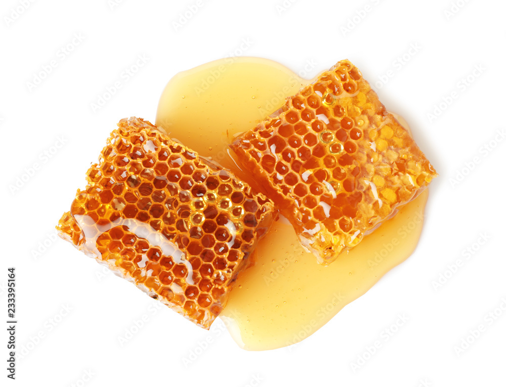 Wall mural Fresh honeycombs on white background, top view