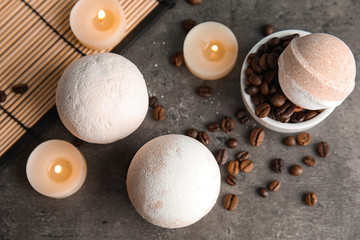 Bath bombs, coffee beans and candles on table, top view