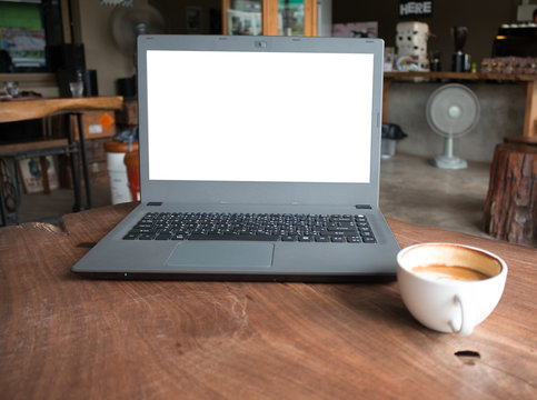Closeup of labtop computer with blank display in coffee shop concept imege made advertize product