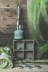 natural spa and wellness background, raw wood, candles, blue and green colors
