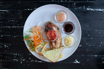 Close up of steak on old wooden table background