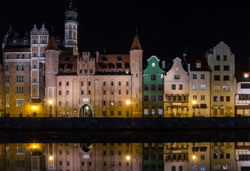 Fototapeta na wymiar Ancient houses on the promenade of Gdansk at night. Poland