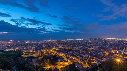 Obraz premium Panorama of Barcelona night to day timelapse, Spain, viewed from the Bunkers of Carmel