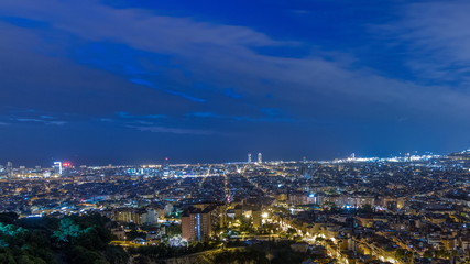 Fototapeta na wymiar Panorama of Barcelona night to day timelapse, Spain, viewed from the Bunkers of Carmel