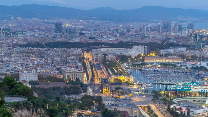 Obraz premium Aerial view over square Portal de la pau day to night timelapse in Barcelona, Catalonia, Spain.