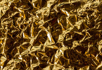 Crumpled gold foil texture background
