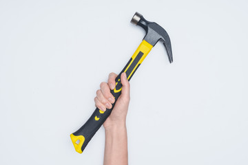 cropped shot of woman holding hammer isolated on white