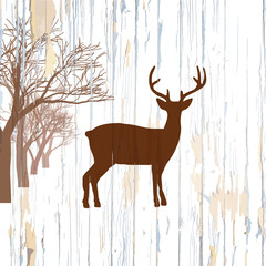 Vintage deer on wooden background