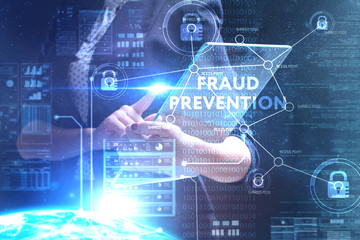 The concept of business, technology, the Internet and the network. A young entrepreneur working on a virtual screen of the future and sees the inscription: Fraud prevention