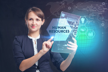 The concept of business, technology, the Internet and the network. A young entrepreneur working on a virtual screen of the future and sees the inscription: Human resources