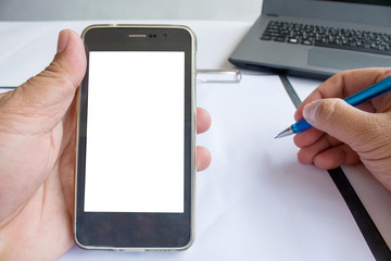 Asian man holding his blank smartphone during work in office