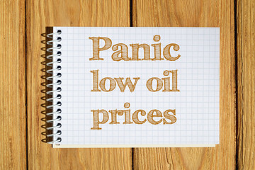 Composite image of digital image of Panic low oil prices text