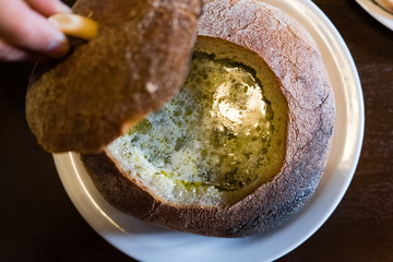 Traditional green borsch in rye bread