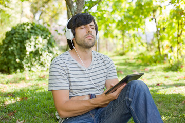 man relaxing with tablet pc
