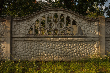  Fence made of concrete. Relief decoration of a fence © Roman