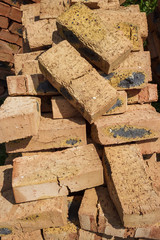 Red brick on the pallet. Texture. Close up