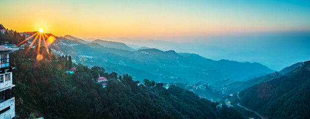 sunrise forming winter line in mussoorie India . layers of mountains top view uttarakhand
