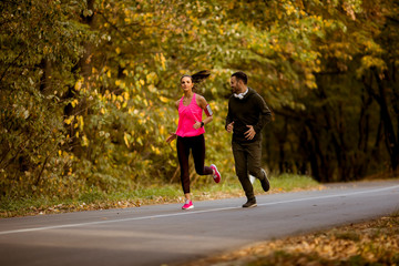 Young people jogging and exercising in nature