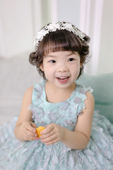 Little pretty Asian girl dressing as princess laughing portrait, healthy and happy lifestyle..