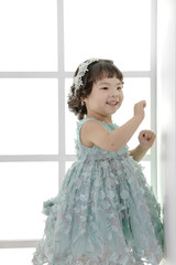 Little pretty Asian girl dressing as princess laughing portrait, healthy and happy lifestyle.