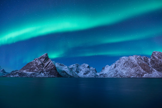 Snow mountain with Aurora in the background/ travel concept world explore northern light / Lofoten norway
