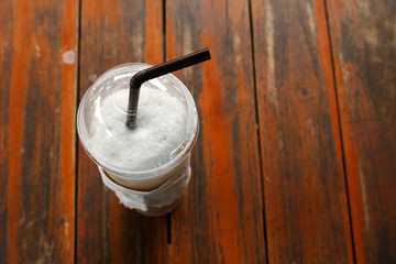 Glass of Cold Iced Coffee put on old table