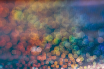 Multicolored abstract bokeh background. Festive beautiful blurred background, blue, aquamarine, green, red,yellow.