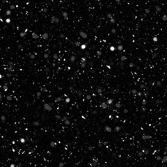 Isolated natural white snow texture effect on black night background. Winter snowflakes.